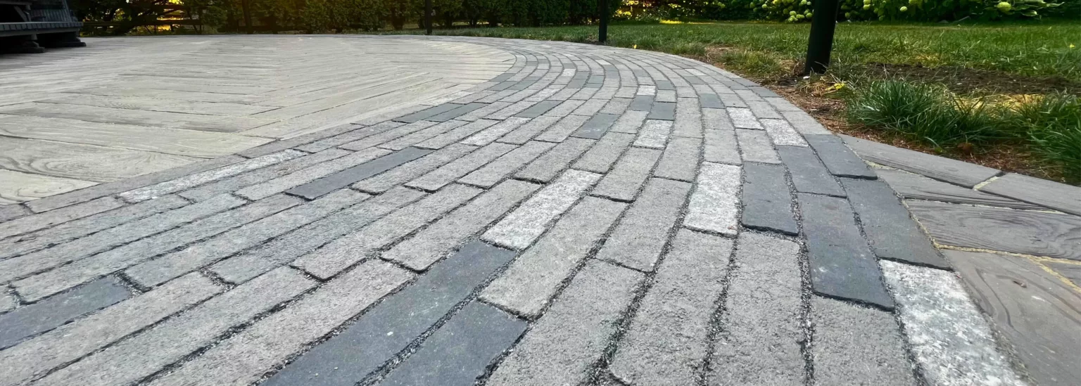 Curved flagstone walkway with Unilock Mattoni pavers and Ecofine mortar in Nashville, Ontario heritage home patio design